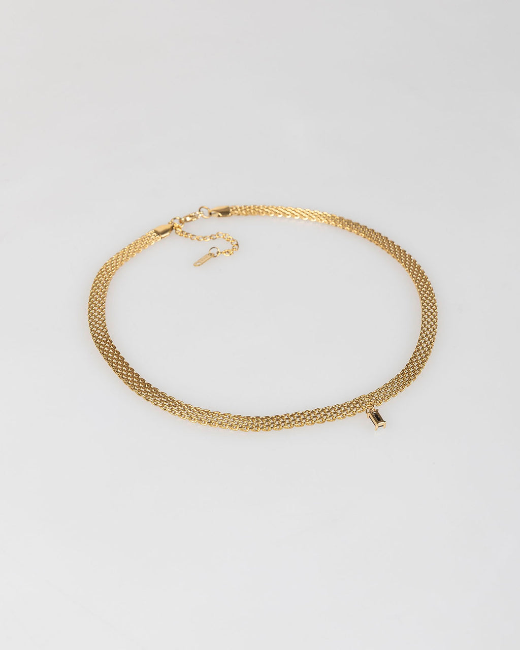 Choker oro con piedra negra