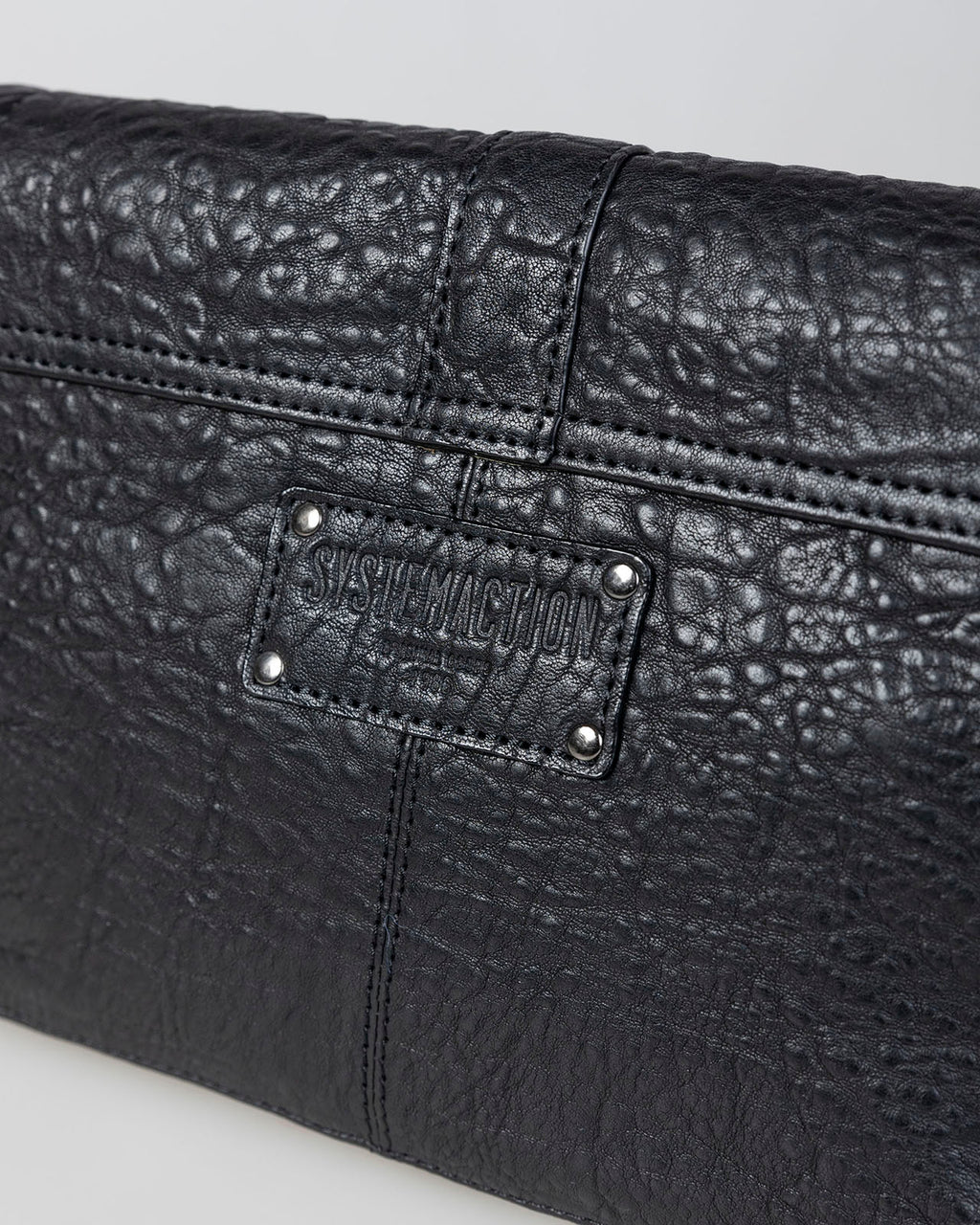 Bolso piel con tachas